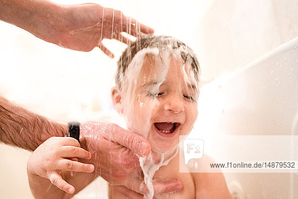 Baby boy enjoying bath time