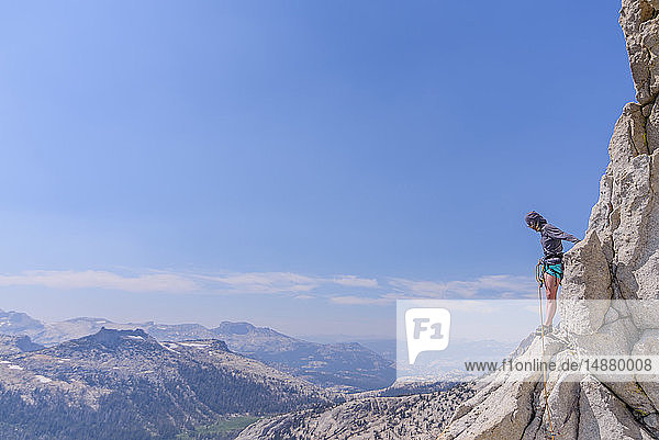 Climber trad climbing  Tuolumne Meadows  Yosemite National Park  California  United States