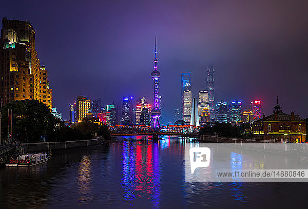 Pudong skyline and Waibaidu Bridge over Huangpu river at night  Shanghai  China