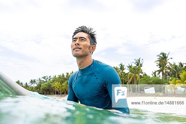 Surfer waiting in sea  Pagudpud  Ilocos Norte  Philippines