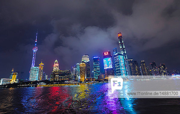 Pudong skyline with Oriental Pearl Tower at night  view from star ferry  Shanghai  China