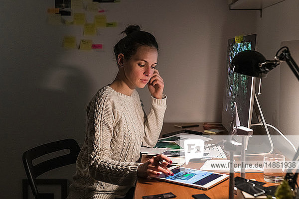 Woman working late at home
