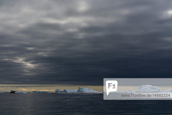 Icebergs under storm clouds  Vibebukta  Austfonna  Nordaustlandet  Svalbard  Norway