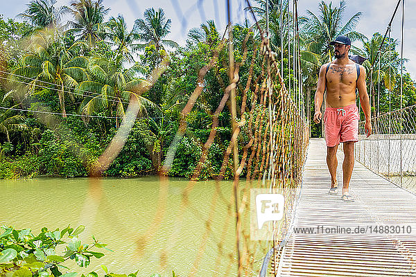 Man on rope bridge  Pagudpud  Ilocos Norte  Philippines