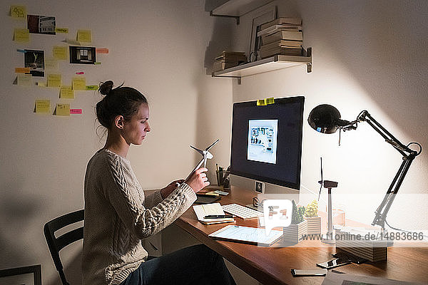 Woman working late at home