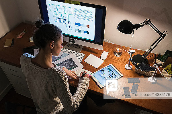 Woman working late at home