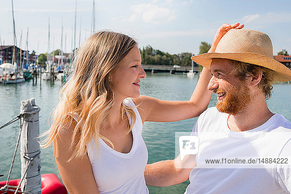 Young couple on sailboat on Chiemsee lakeside  Bavaria  Germany