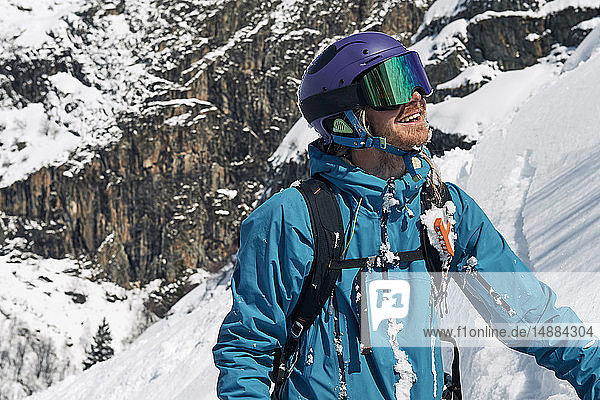 Male skier looking up mountainside  Alpe-d'Huez  Rhone-Alpes  France
