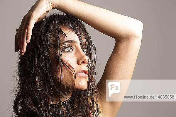 Portrait of young woman with damp hair