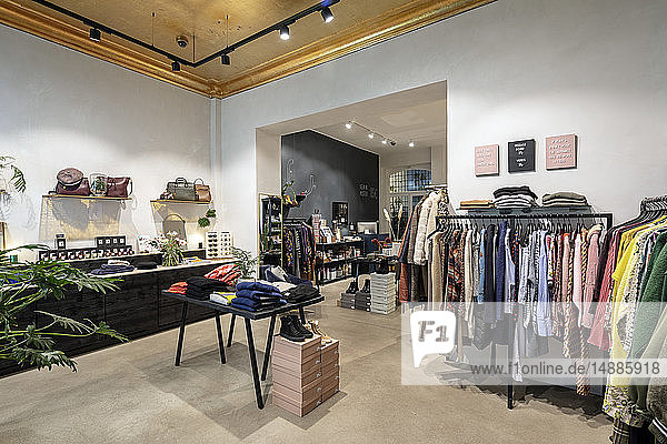 Interior of a modern concept store displaying fashion
