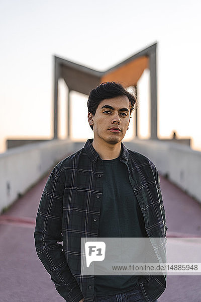 Spain  Barcelona  portrait of young man at sunset