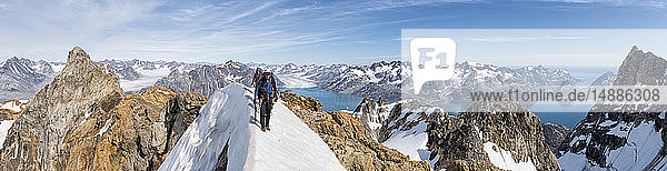 Greenland  Sermersooq  Kulusuk  Schweizerland Alps  mountaineers walking in snowy mountainscape