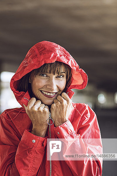 Woman wearing red rain coat  portrait