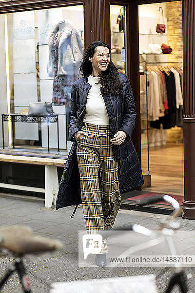 Happy woman on a shopping spree in the city