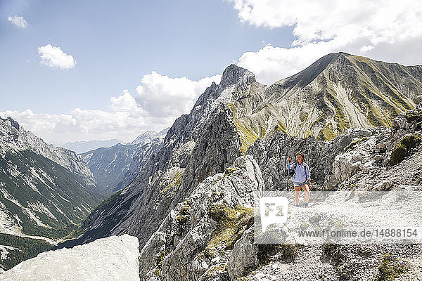 Austria  Tyrol  woman on a hiking trip in the mountains