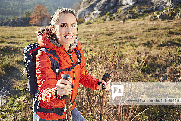 Portrait of smiling woman on a hiking trip in the mountains