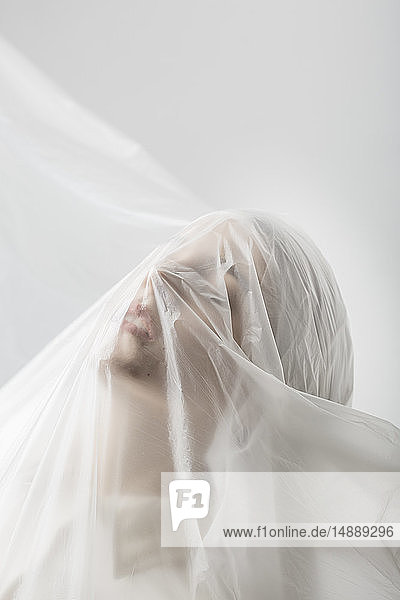 Graceful woman trapped in a veil
