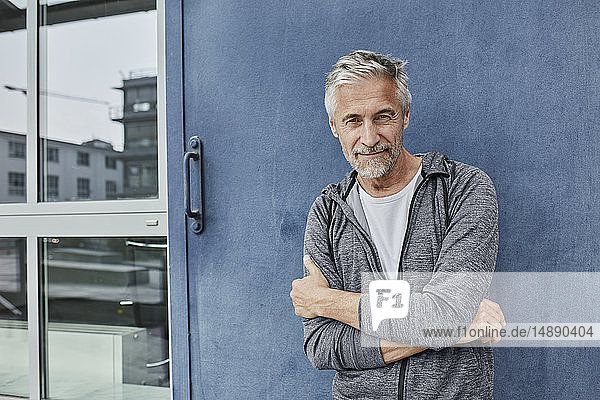 Portrait of mature man in front of gym