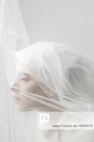 Graceful woman trapped in a veil