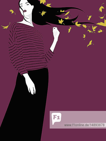 Windswept woman in autumn leaves