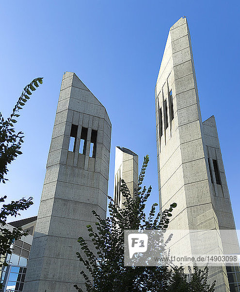 Cement towers against a blue sky at the entrance of MacEwan University; Edmonton Alberta Canada