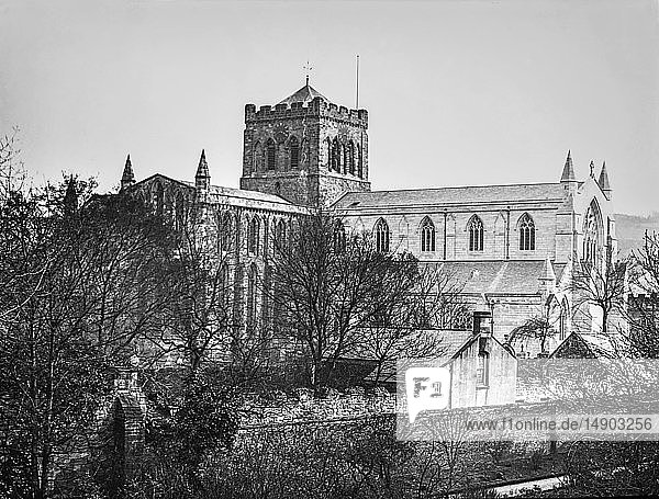 A magic lantern slide circa 1900. Religious slides . Hexham Abbey is a place of Christian worship dedicated to St Andrew located in the town of Hexham  Northumberland  in northeast England. Originally built in AD 674  the Abbey was built up during the 12th Century into its current form  with additions around the turn of the 20th Century. Since the Dissolution of the Monasteries in 1537  the Abbey has been the parish church of Hexham.