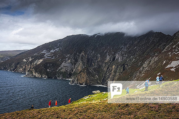 Tourists overlooking the coastline at Slieve League; County Donegal  Ireland