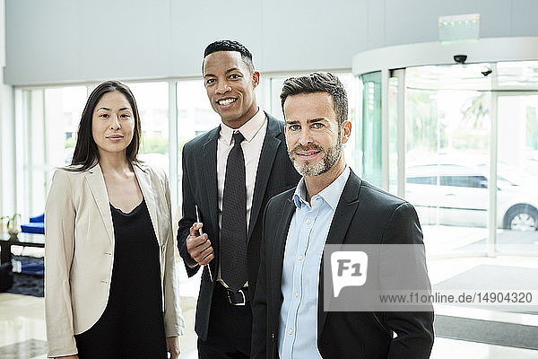 Business people standing in hotel lobby
