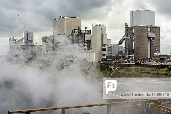 IJmuiden Netherlands. Huge heavy steel production plant and industry terrain producing various kinds of steel inside an CO2 emitting factory. The steel plant is called Hoogovens and is owned by Tata Steel an international corporation who also suffers from decline in revenues and ever increasing demands on corporate responsibility regarding labour and climate.
