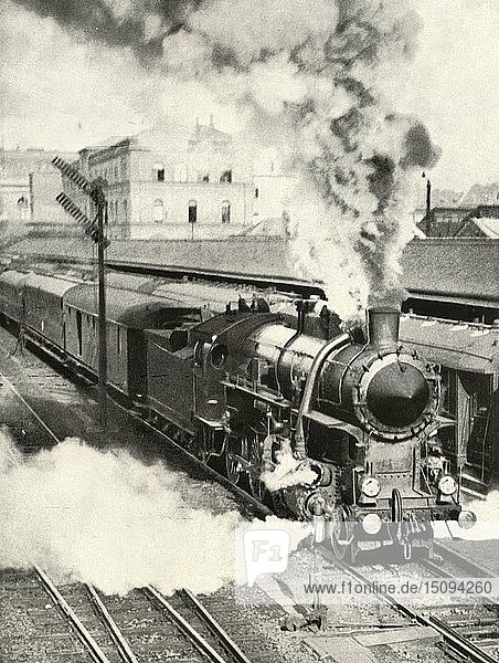 'Leaving Budapest. An express train departs from the Central Station'  1935-36. Creator: Unknown.