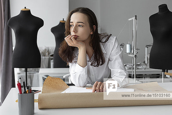 Fashion designer thinking at desk