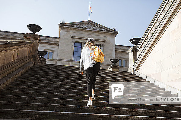 Young woman walking on steps in Berlin  Germany