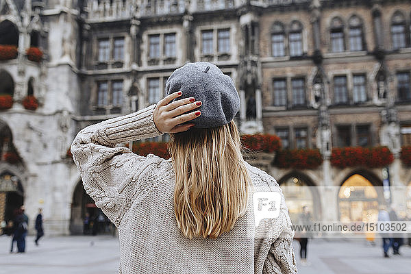 Woman wearing beret by New Town Hall in Munich  Germany