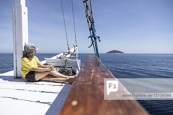 Indonesia  Komodo National Park  girl on a sailing boat