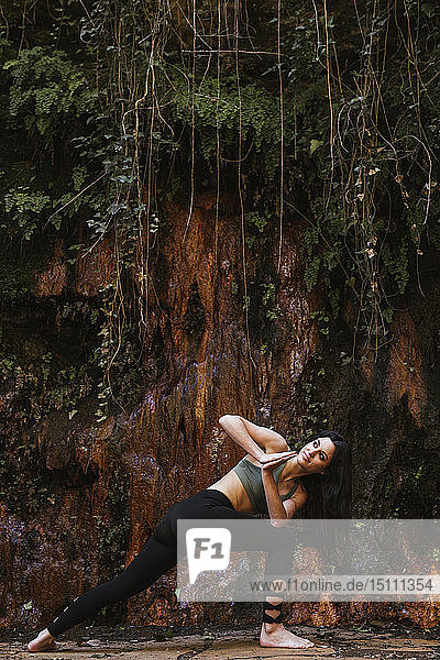 Woman practicing yoga in nature