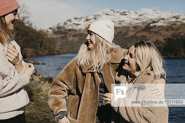 UK  Scotland  happy female friends at Loch Lomond
