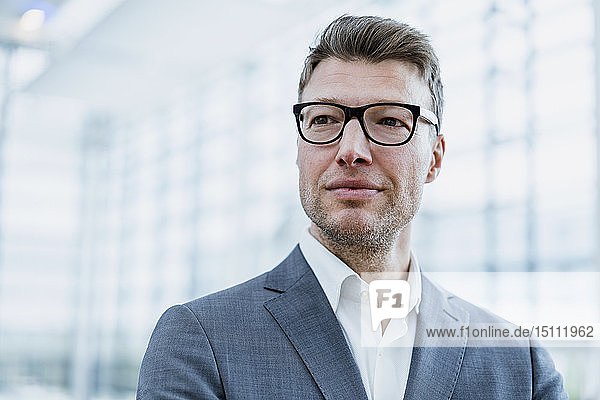 Portrait of confident businessman with glasses
