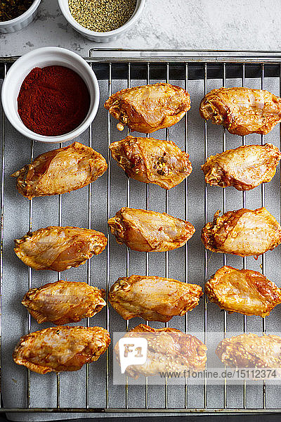 Preparing of spicy chicken wings grid