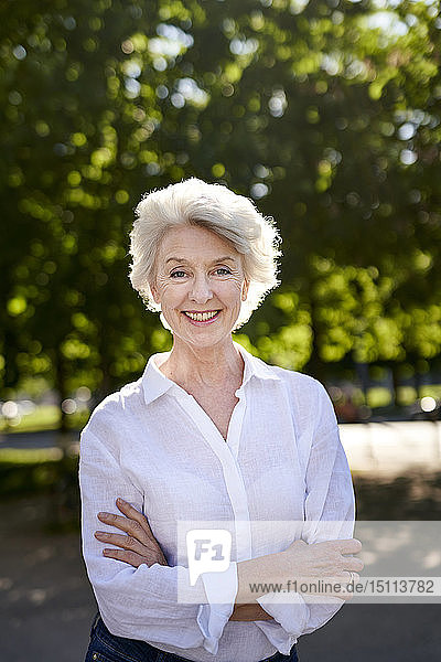 Portrait of smiling mature woman outdoors