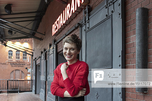 Germany  Berlin  portrait of smiling restaurant manager outdoors