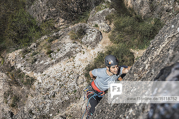 Man climbing in rock wall