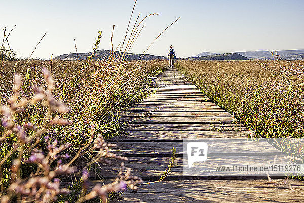 Greece Messenia Gialova Lagoon hiker on the nature trail