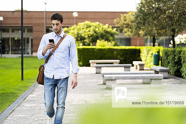 Young man using smartphone in the city