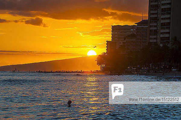 Hawaii  Oahu  Waikiki beach  sunset over the high rise buildings