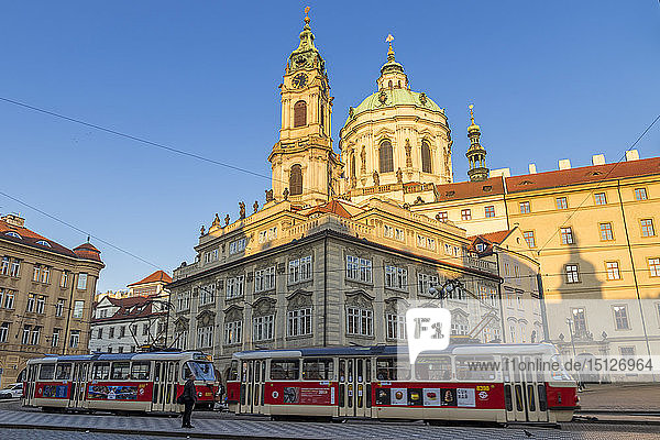 The famous tram no. 22 passing the Malostranske Namesti Square and St. Nicholas Church  Prague  Bohemia  Czech Republic  Europe