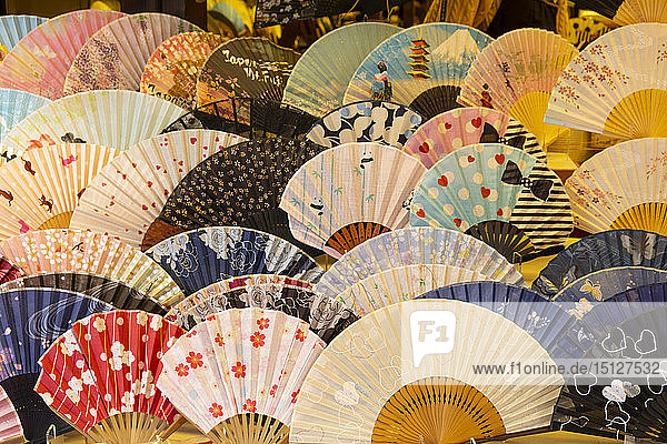 Colourful Japanese fans for sale at a souvenir shop in Kyoto Japan Asia