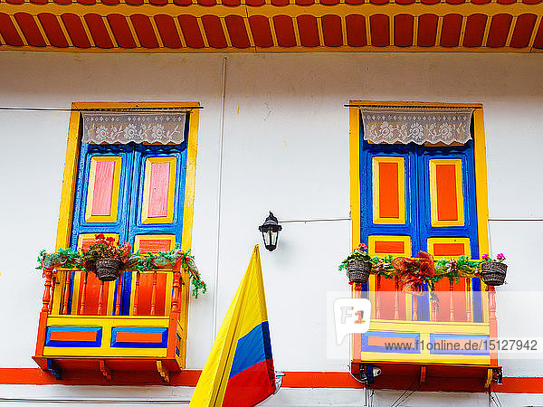 House painted in the colors of the Colombian flag (center)  Filandia  Coffee Region  Colombia  South America
