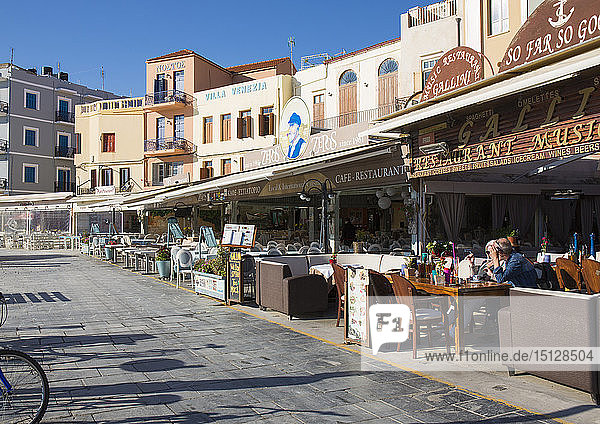 Colourful waterfront cafes and hotels beside the Venetian Harbour  Hania (Chania)  Crete  Greek Islands  Greece  Europe