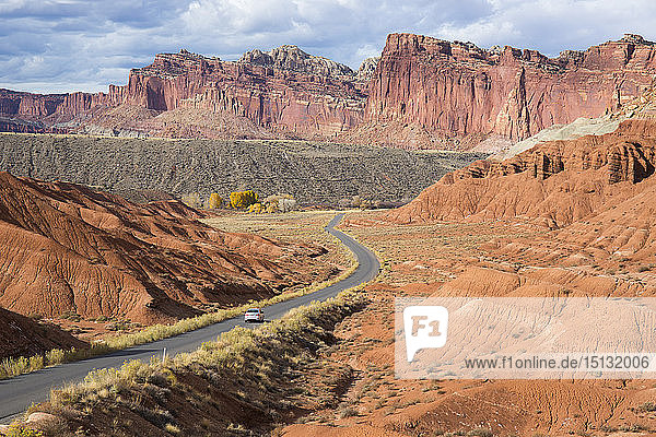 Car heading north along the Scenic Drive towards the Waterpocket Fold  Fruita  Capitol Reef National Park  Utah  United States of America  North America