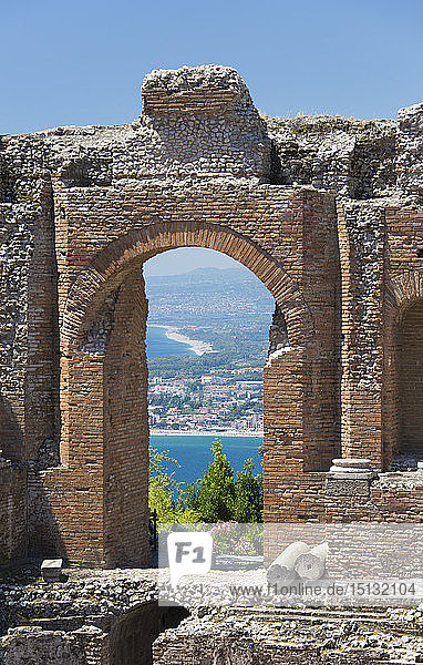 View From The Greek Theatre Through Arch To The Bay Of Naxos Taormina Messina Sicily Italy Mediterranean Europe